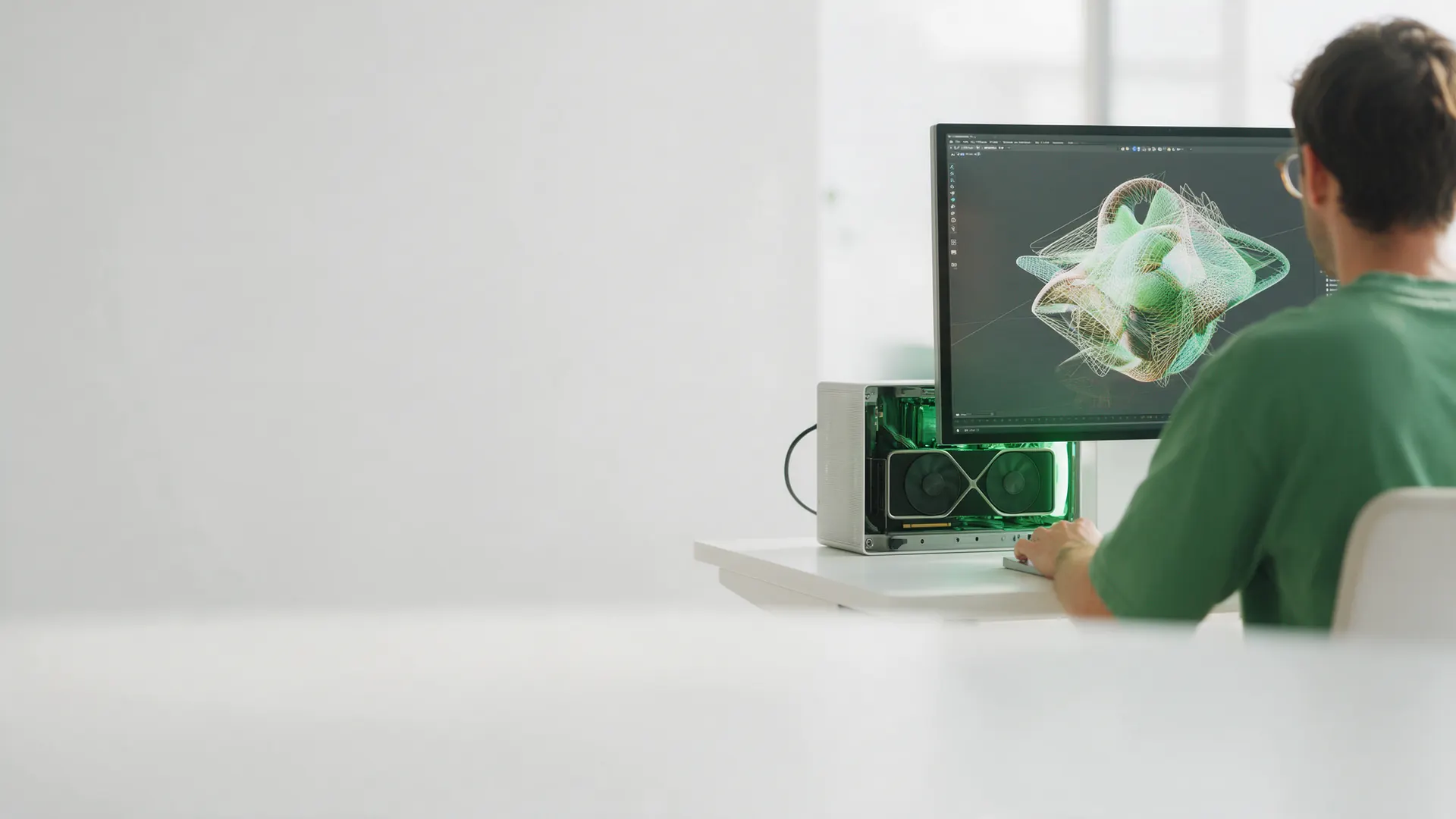 Estação de trabalho com placa de vídeo aparente ao lado de um monitor com render 3D
